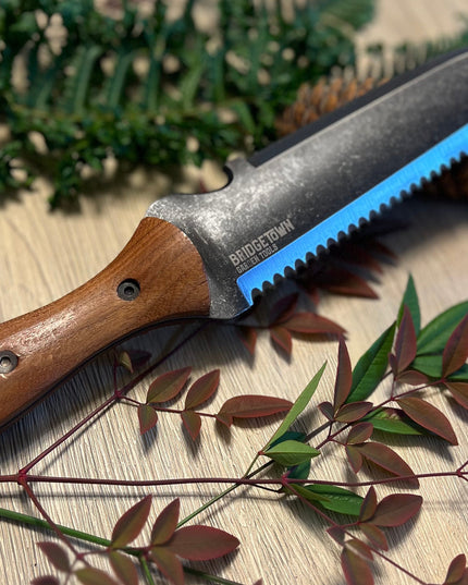 Essential Hori Hori knife on a table with freshly cut greens