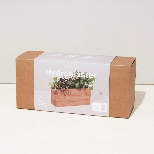 the smart bamboo hydroplanter in its packaging - a clean rectangular box with an image of the hydroplanter on it