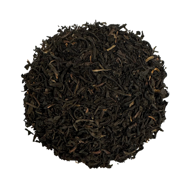 a rounded pile of lapsang souchong tea against a white background