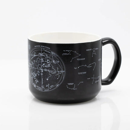 the other side of a black coffee mug with printed astronomy charts of the night sky and constellations