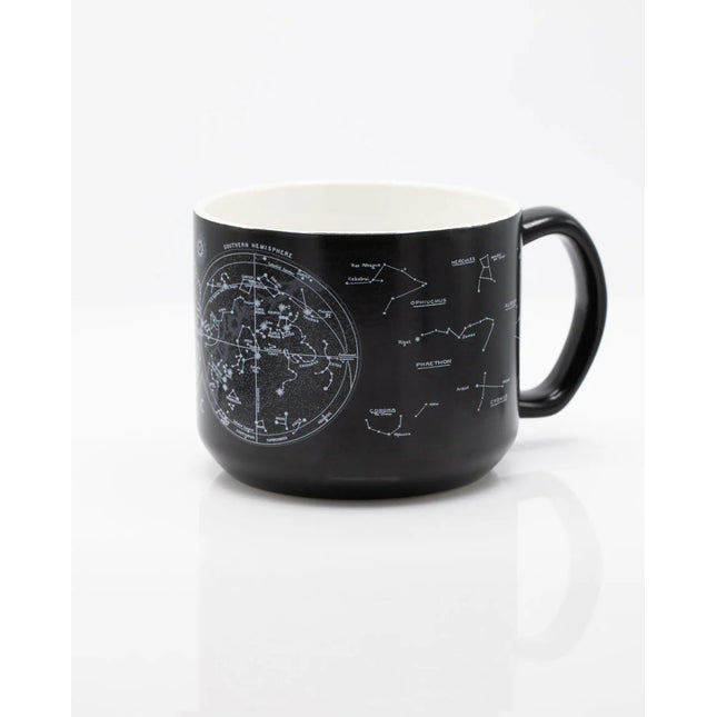 the other side of a black coffee mug with printed astronomy charts of the night sky and constellations