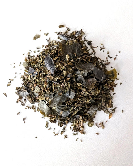 a small mound of loose leaf Ocean Mint tea showing the seaweed and mint blend