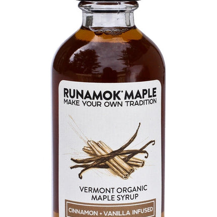 a bottle of the cinnamon and vanilla infused maple syrup from the pantry favorites collection against a white background