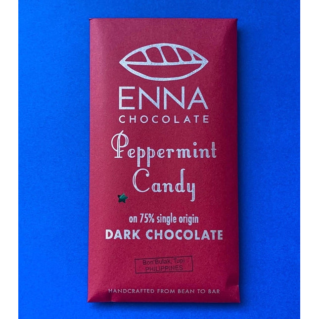 A festive burgundy red chocolate bar wrapper with the Enna Chocolate logo and "Peppermint Candy" in playful, festive text