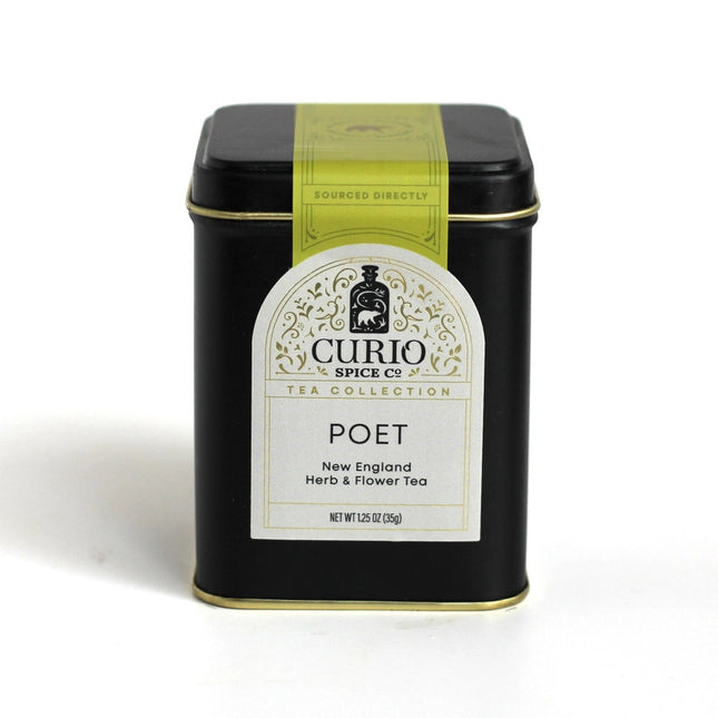 The poet tea tin - a black rectangular box with an elegant white label with green seal