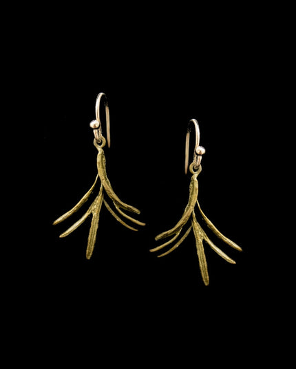 cast bronze sprigs of rosemary hanging from gold earring wire