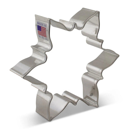 Icy Snowflake Cookie Cutter displayed on a white background. The metal cutter features a detailed snowflake design with six distinct points, ideal for creating festive, snowflake-shaped cookies