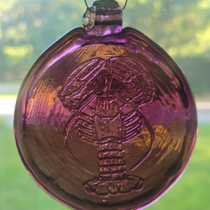 Purple glass suncatcher with realistic lobster design.