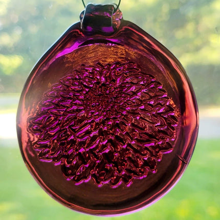 Dark purple glass suncatcher with a chrysanthemum flower design.