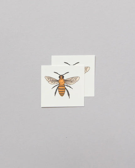 two sets of honey bee temporary tattoos showing the tattoo layout on the sheets