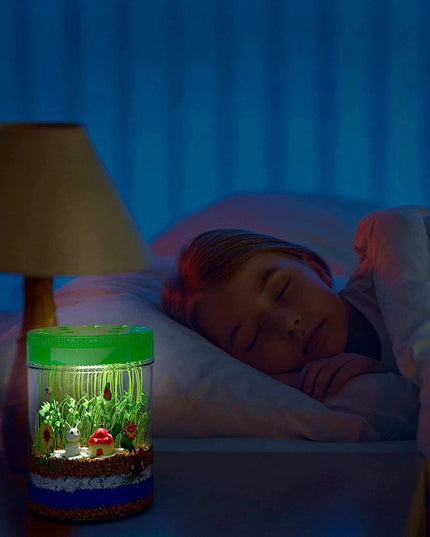 kids light up terrarium lit up at night on a bedside table showing a subtle glow