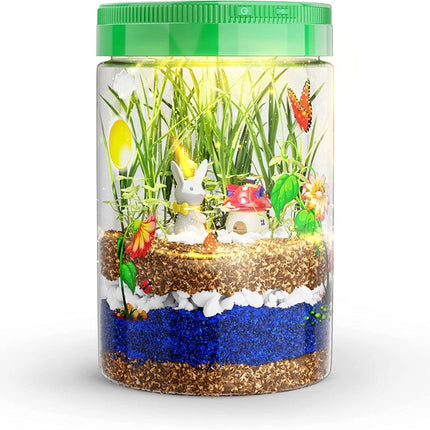 kids light up terrarium showing growing plants, decorative figures and stickers, and layers of soil
