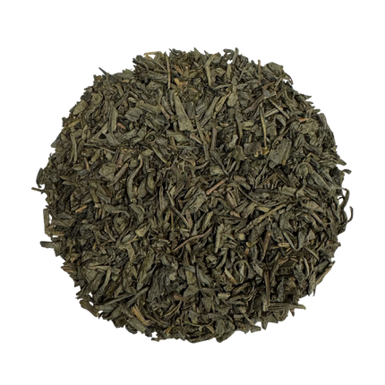 Dry green tea leaves on a white background